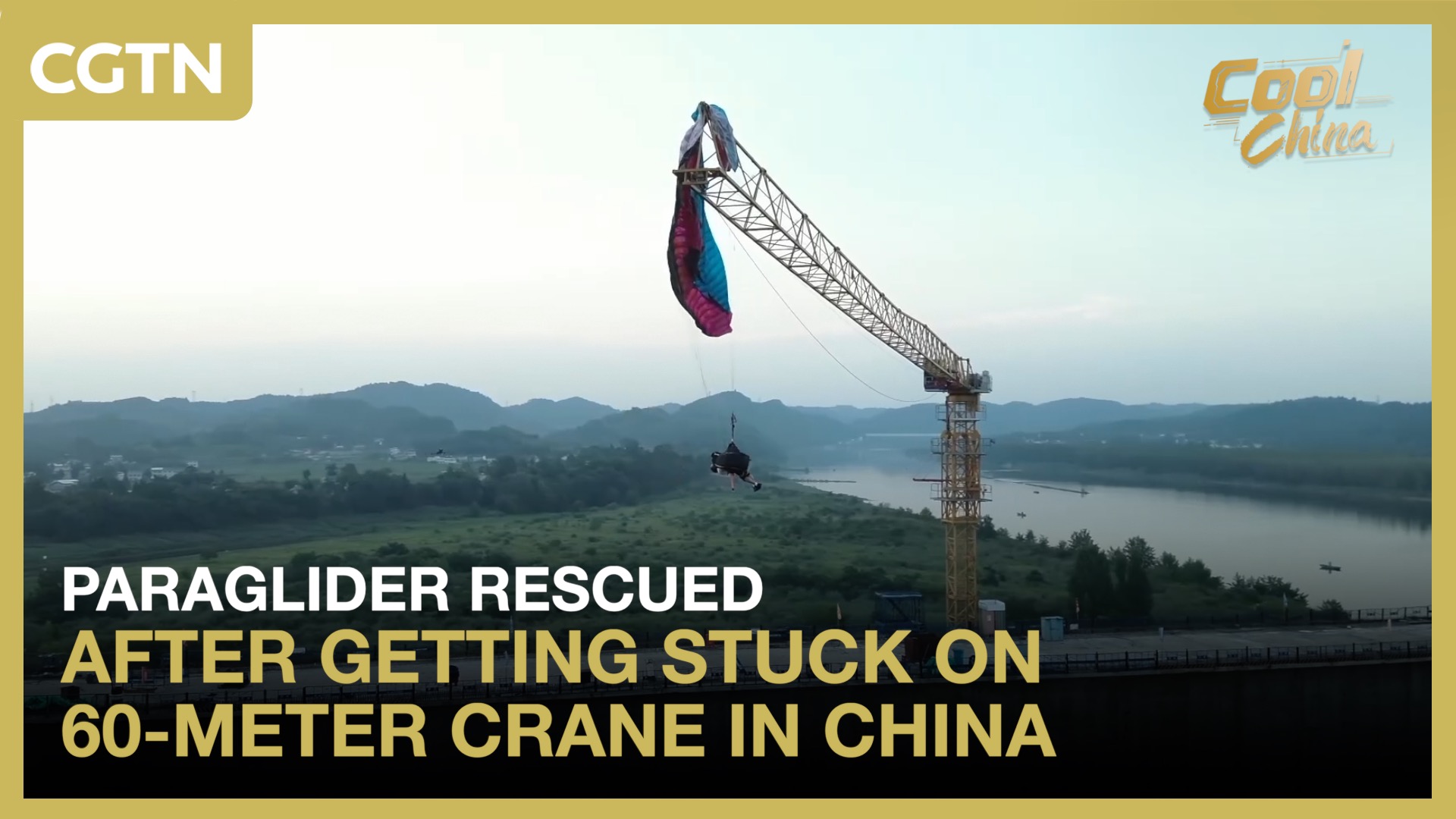 Paraglider rescued after getting stuck on 60-meter crane in China