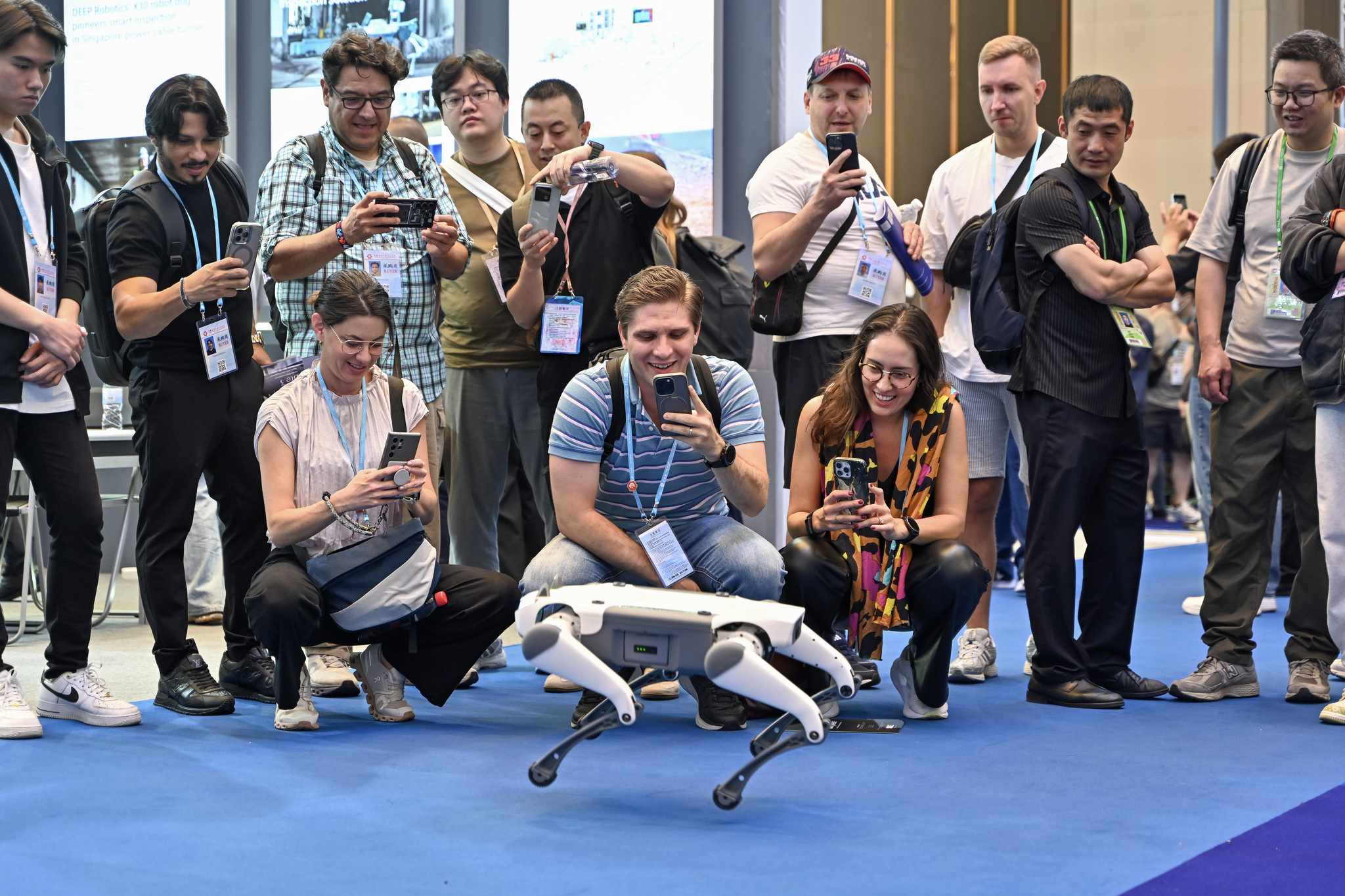 Participants photograph a robot at the 137th China Import and Export Fair, Guangdong Province, China, April 15, 2025. /VCG