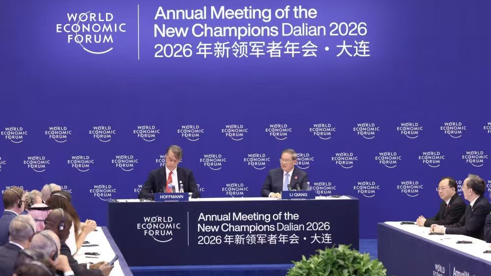 Chinese Premier Li Qiang attends a symposium for international business representatives at the 17th Annual Meeting of the New Champions, also known as the Summer Davos, in the city of Dalian, northeast China's Liaoning Province, June 24, 2026. / Xinhua
