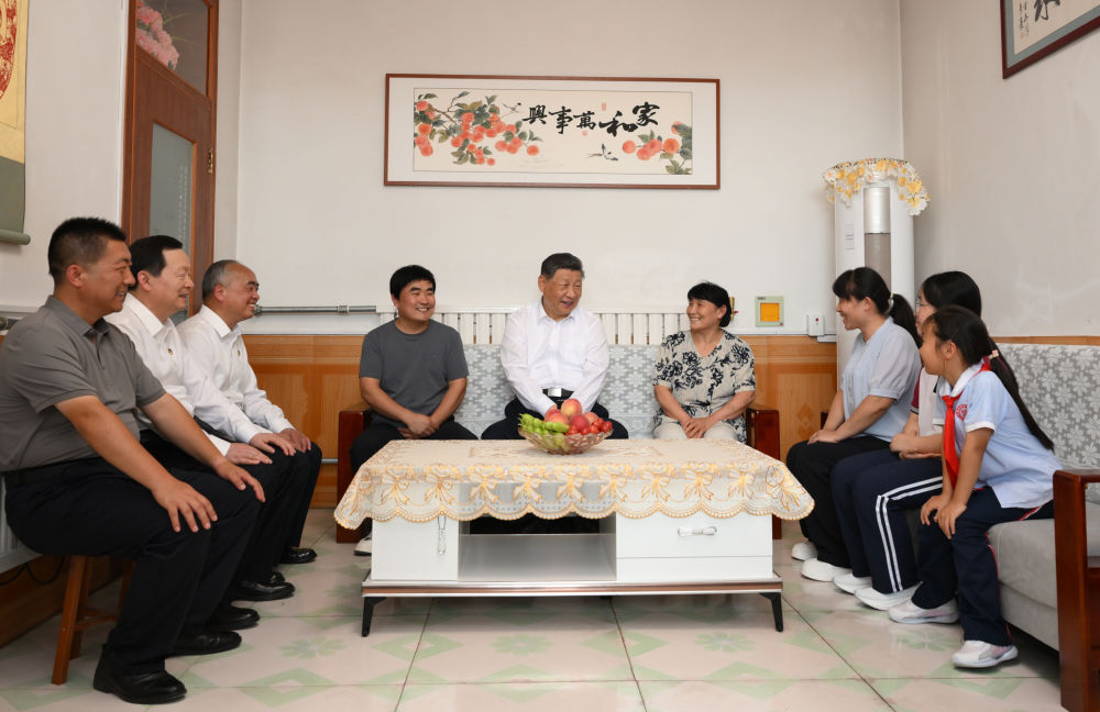 Chinese President Xi Jinping, also general secretary of the Communist Party of China (CPC) Central Committee and chairman of the Central Military Commission, sits down with Yu Xinhui's family to ask about their daily lives during his inspection trip to Dezhou, Shandong Province, China, on June 24, 2026. /Xinhua