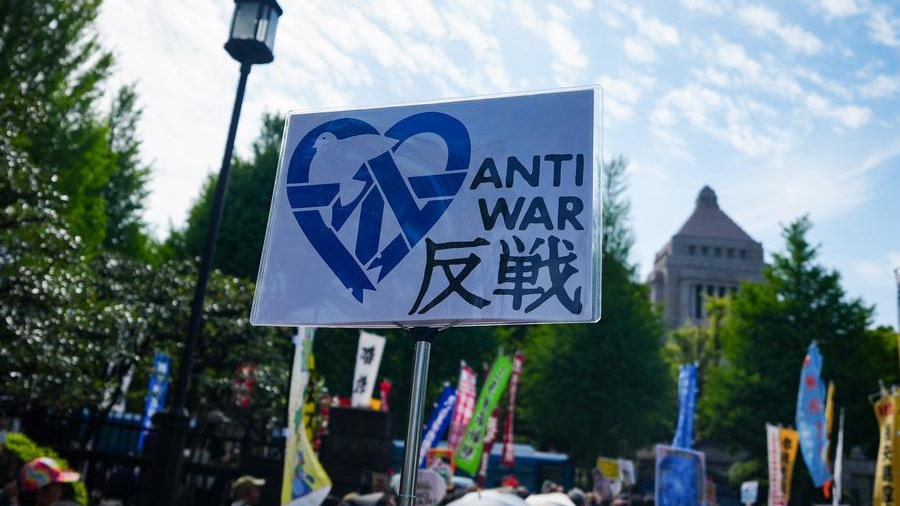 People gather around the parliament building to protest attempts of the government of Japanese Prime Minister Sanae Takaichi to revise the country's pacifist constitution and to call for the protection of Article 9 in Tokyo, Japan, April 19, 2026. /Xinhua