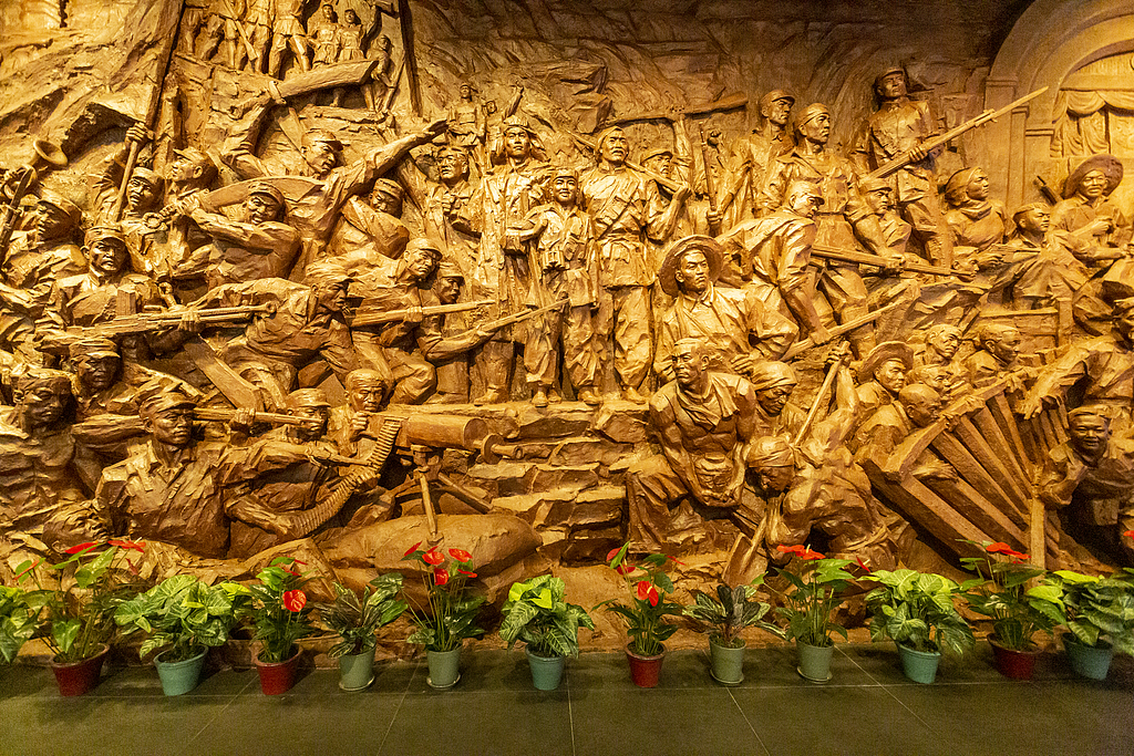 A sculpture of revolutionaries led by the Communist Party of China (CPC) is displayed at the exhibition 