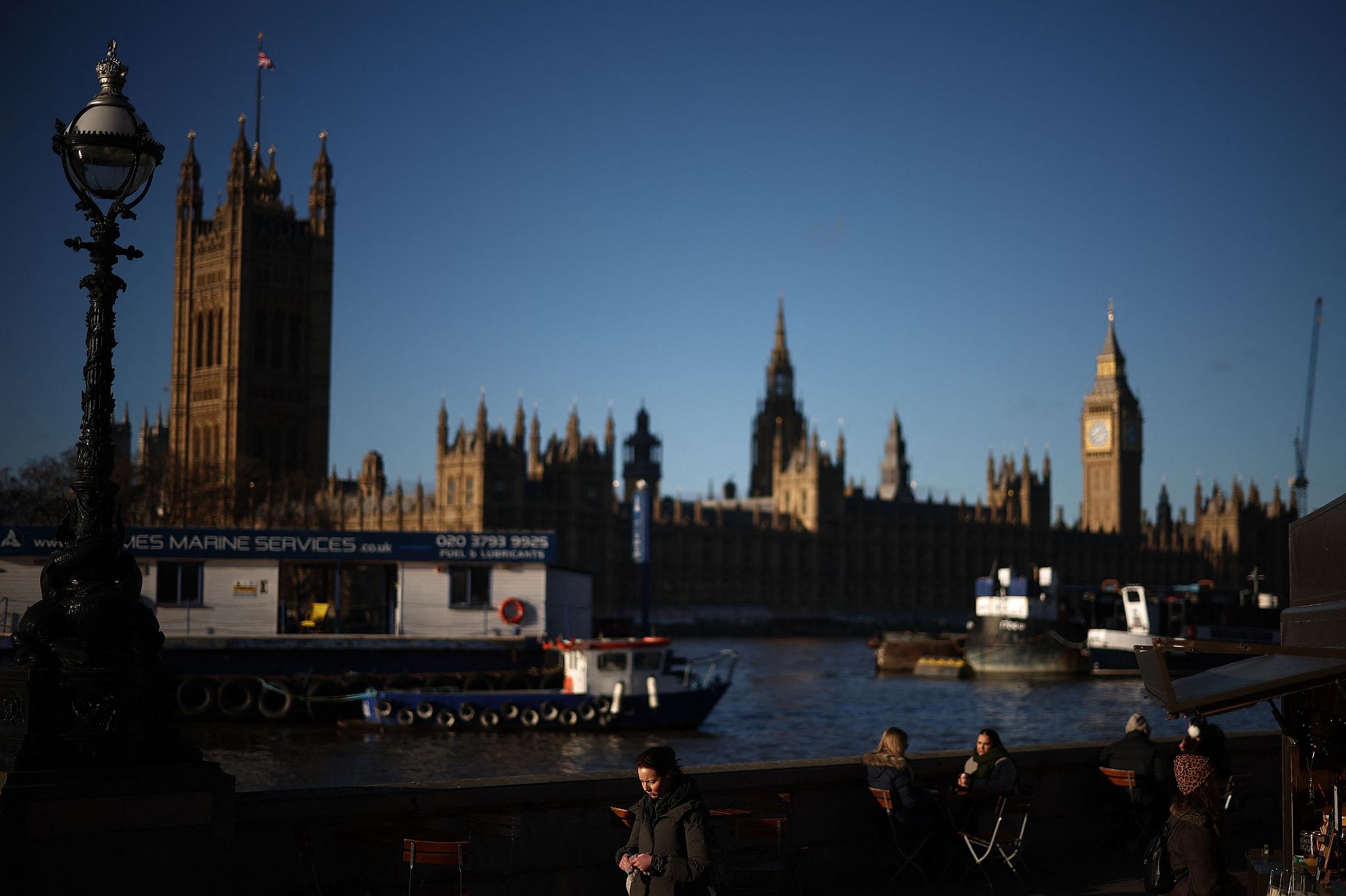 People walk on the south bank with the Palace of Westminster, home to the Houses of Parliament behind, London, UK, January 4, 2026. /AFP