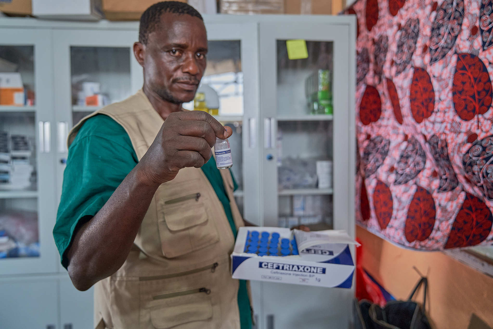 A staff member checks vials of Ceftriaxone, an antibiotic used to treat bacterial infections, at an Ebola treatment center run by the NGO Alliance for Medical Action (ALIMA) in Rwampara health zone, Ituri Province, Democratic Republic of Congo, June 20, 2026. /VCG
