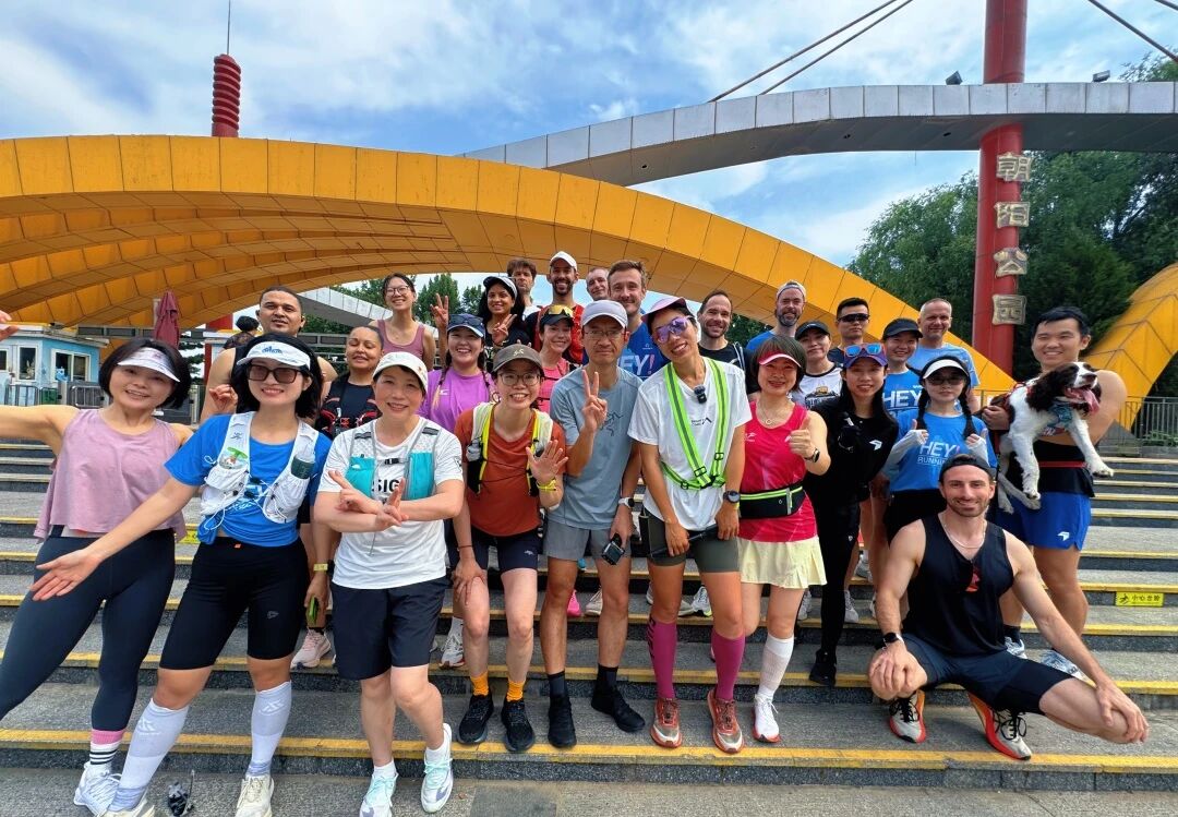 The Hey Running group gathers before a morning run in Beijing. Organized running communities are becoming an increasingly important source of friendship and connection in Chinese cities, June 2026. /Hey Running