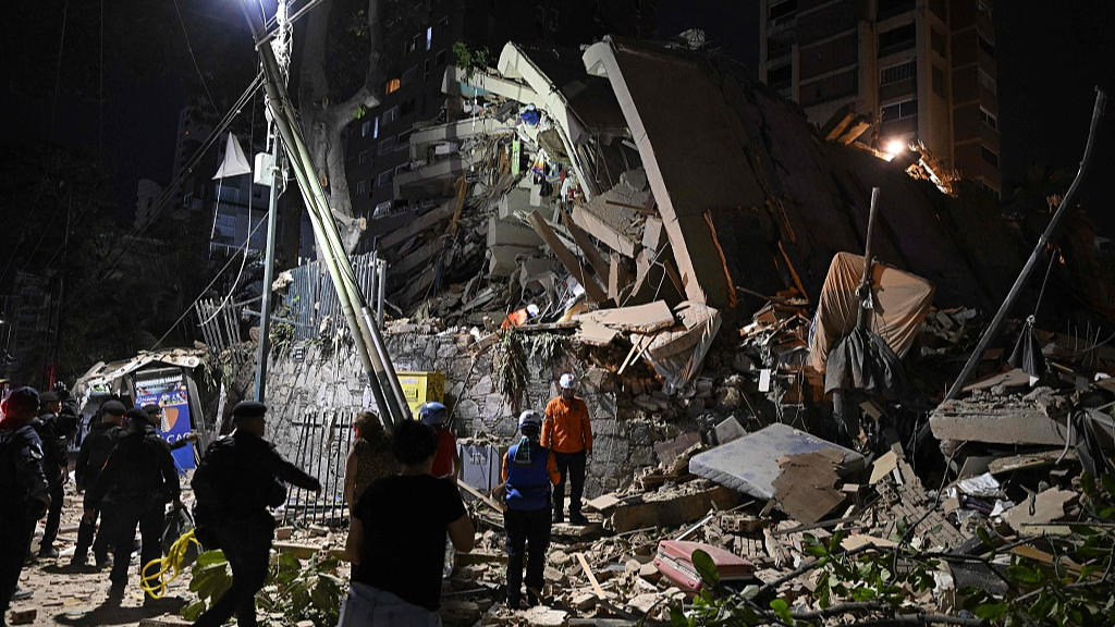 Rescuers search through the rubble of a collapsed building following the earthquakes, Caracas, Venezuela, June 24, 2026. /VCG