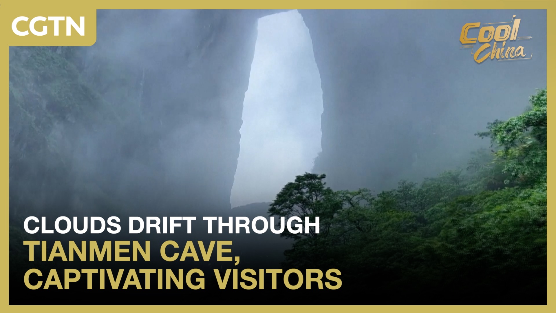 Clouds drift through Tianmen Cave, captivating visitors