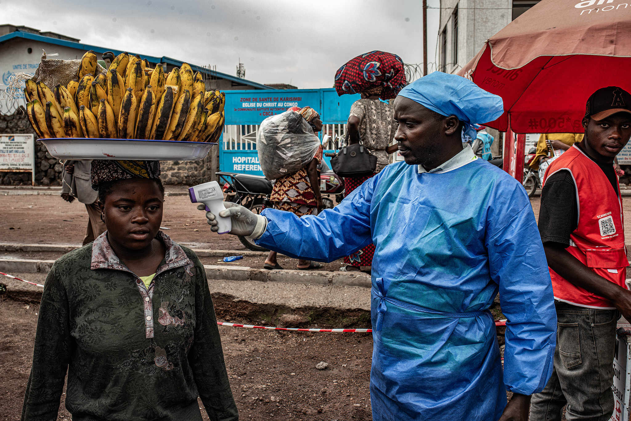 A health worker takes a woman's temperature as part of Ebola screening efforts in Goma, the Democratic Republic of the Congo, June 24, 2026. /VCG