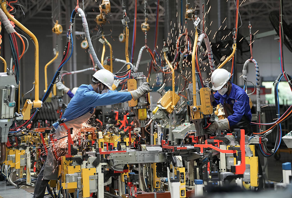 Workers assemble new energy vehicles on a production line at Wuling New Energy Automobile Co., Ltd. in Liuzhou, south China's Guangxi Zhuang Autonomous Region, June 18, 2026. /CFP