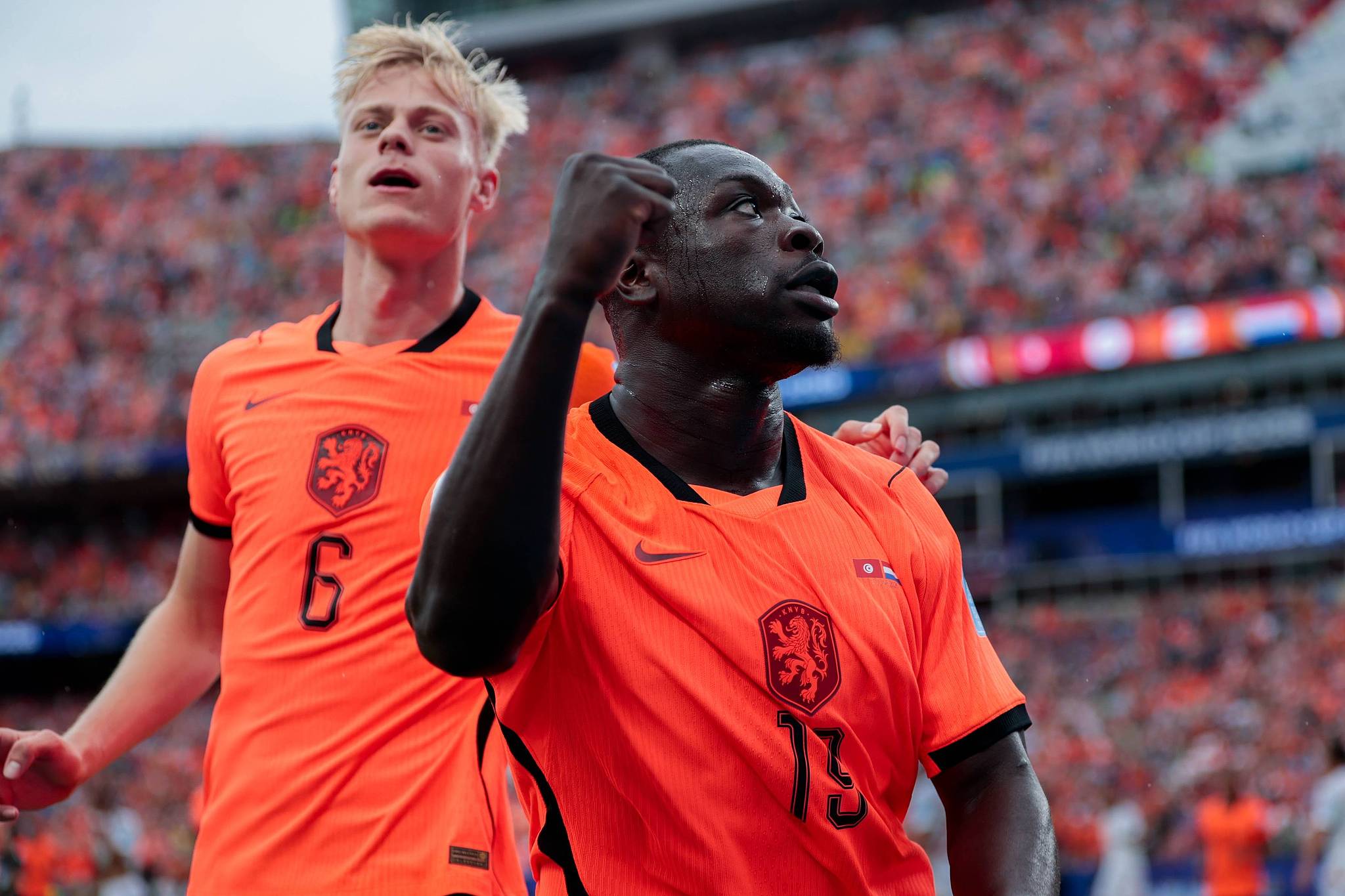 Netherlands player Brian Brobbey (R) celebrates scoring his team's second goal during the World Cup Group F match between Tunisia and the Netherlands at the Kansas City Stadium in Kansas City, US, June 25, 2026. /VCG