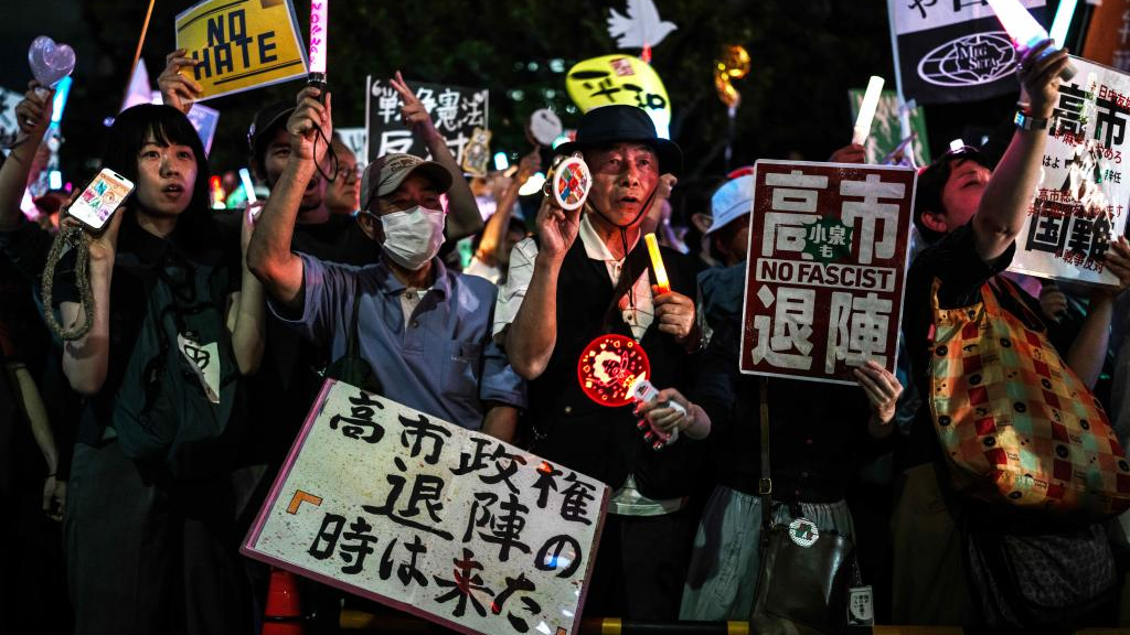 People holding signs attend a protest rally in front of the National Diet Building in Tokyo, Japan, May 29, 2026. /Xinhua