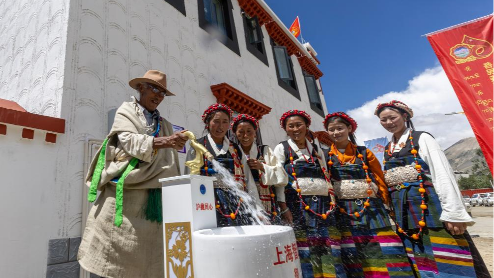Villagers celebrate tap water as they move to their newly-built houses in Zimgag, a village in the city of Xigaze, Xizang Autonomous Region, China, August 15, 2025. /Xinhua