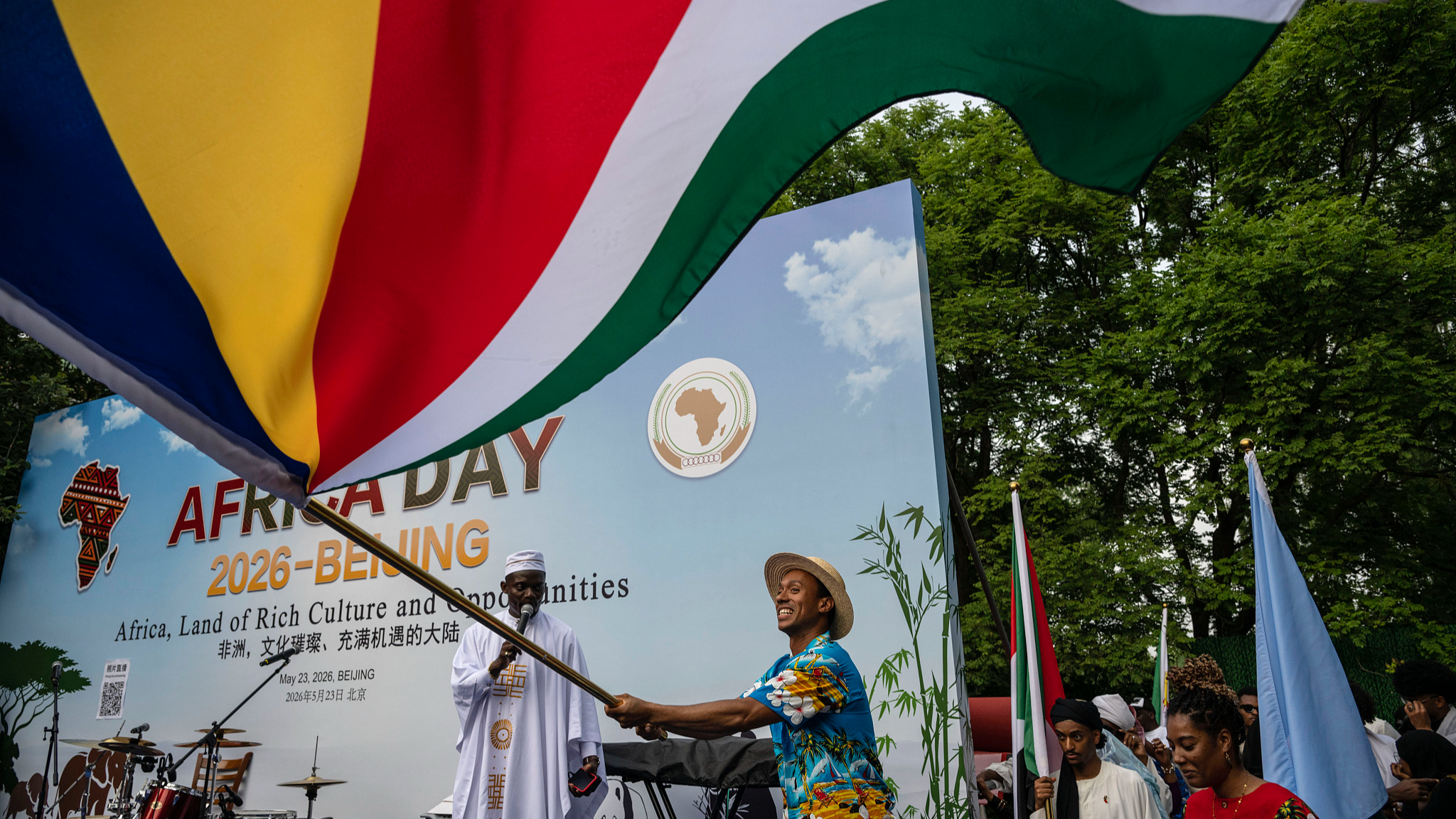A man from the Seychelles waves the country's flag as he takes part in Africa Day 2026, an event held to mark the 70th anniversary of China-Africa diplomatic ties and the China-Africa Year, in Beijing, China, May 23, 2026. /VCG