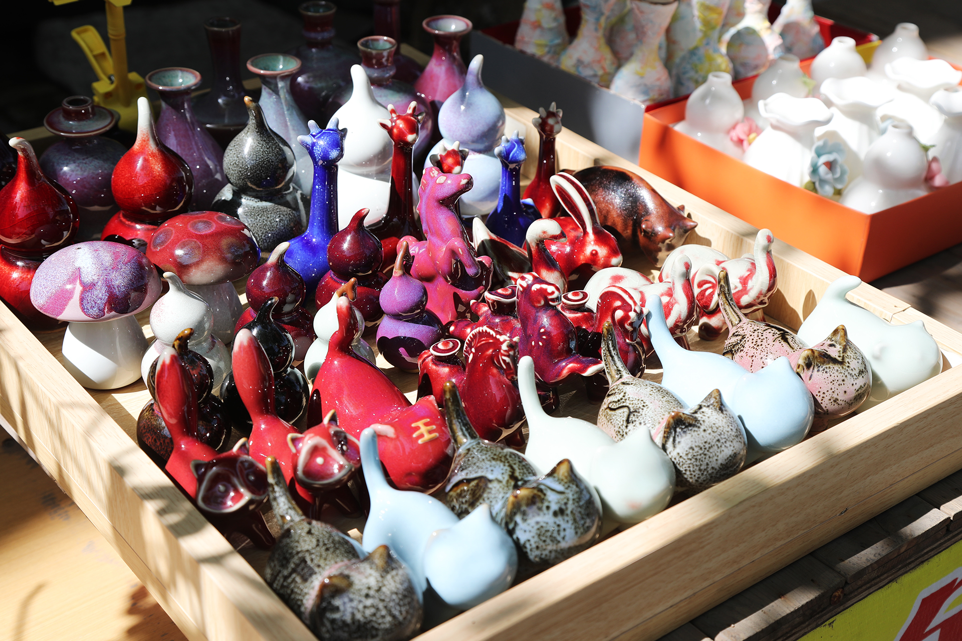Small porcelain items are on display outside a shop at Shenhou Ancient Town in Yuzhou, Henan Province. /CGTN