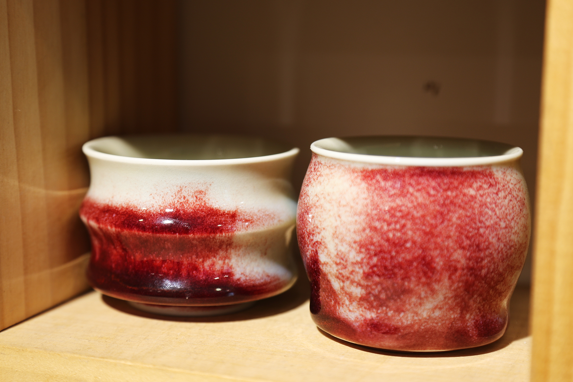 Small Jun porcelain pieces are seen on display at a shop at Shenhou Ancient Town in Yuzhou, Henan Province. /CGTN