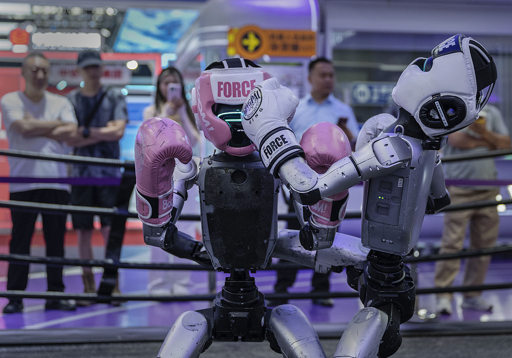 Two humanoid robots box each other showing off their skills in the Zhejiang Province area at the Chinese International Supply Chain Expo (CISCE) in Beijing, China, June 26, 2026. /CFP 
