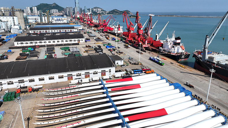 Large quantities of wind power equipment are gathering at the dock of the Oriental Port Branch Company of Lianyungang Port in Jiangsu Province, awaiting shipment for export, May 31, 2026. /VCG