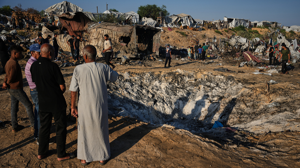 Palestinians inspect damage to their tents following an Israeli airstrike in Khan Younis, Gaza, June 30, 2026. /VCG