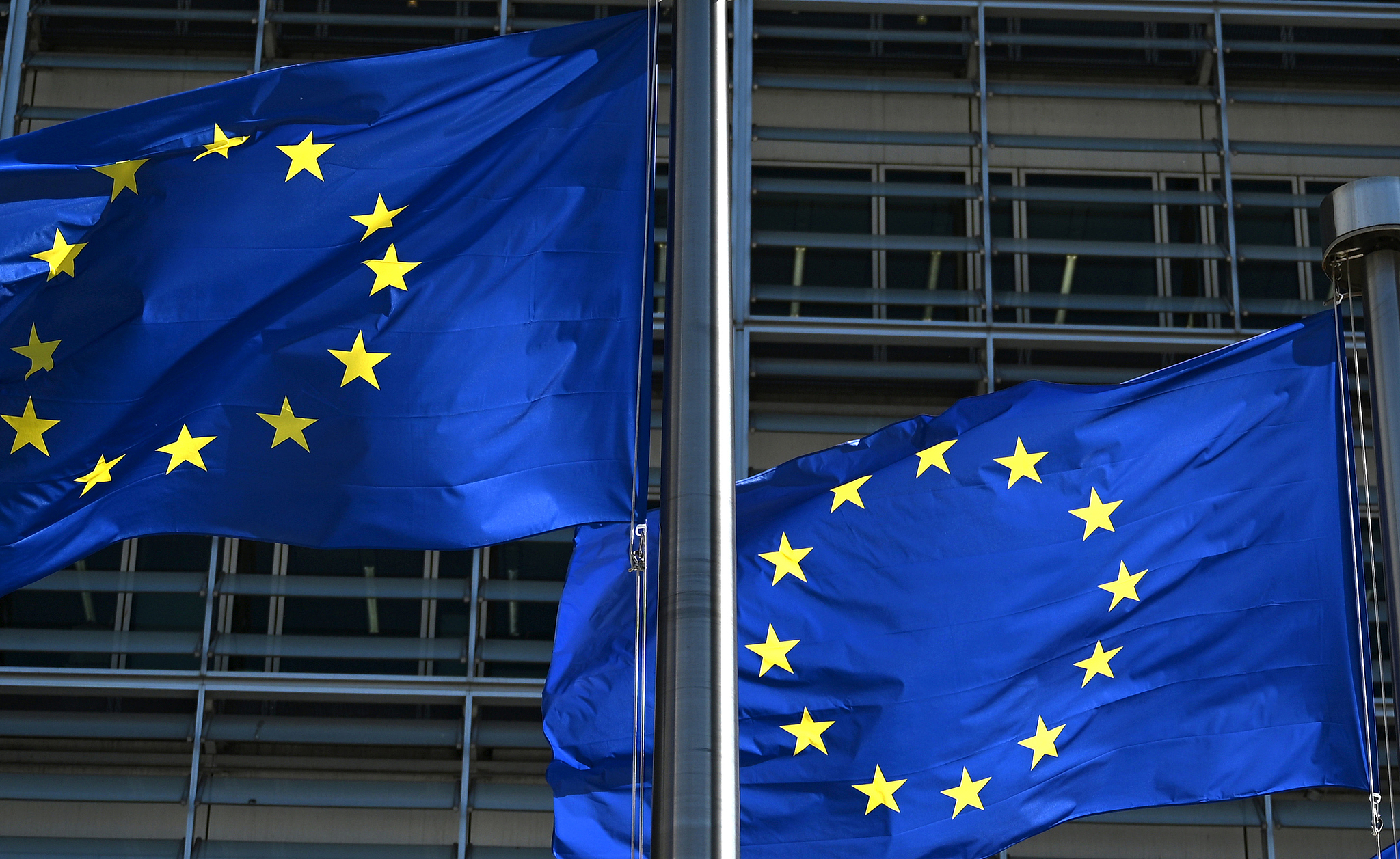 Flags of the European Union wave in the wind in front of the European Commission building in Belgium, 22 May 2026. /VCG
