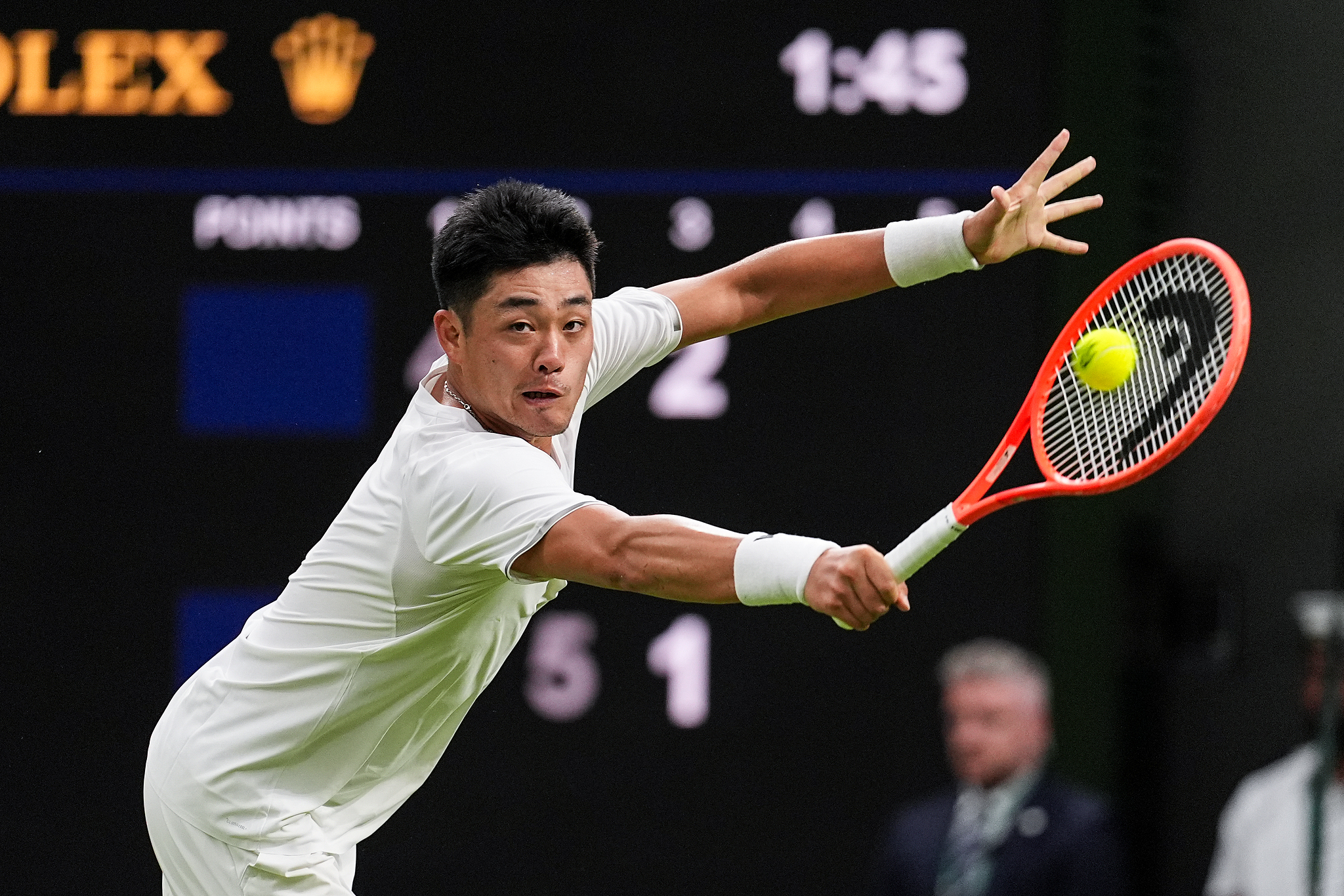 China's Wu Yibing hits a shot in the men's singles first-round match against Serbia's Novak Djokovic at the Wimbledon Championships at All England Lawn Tennis and Croquet Club in London, England, June 29, 2026. /VCG