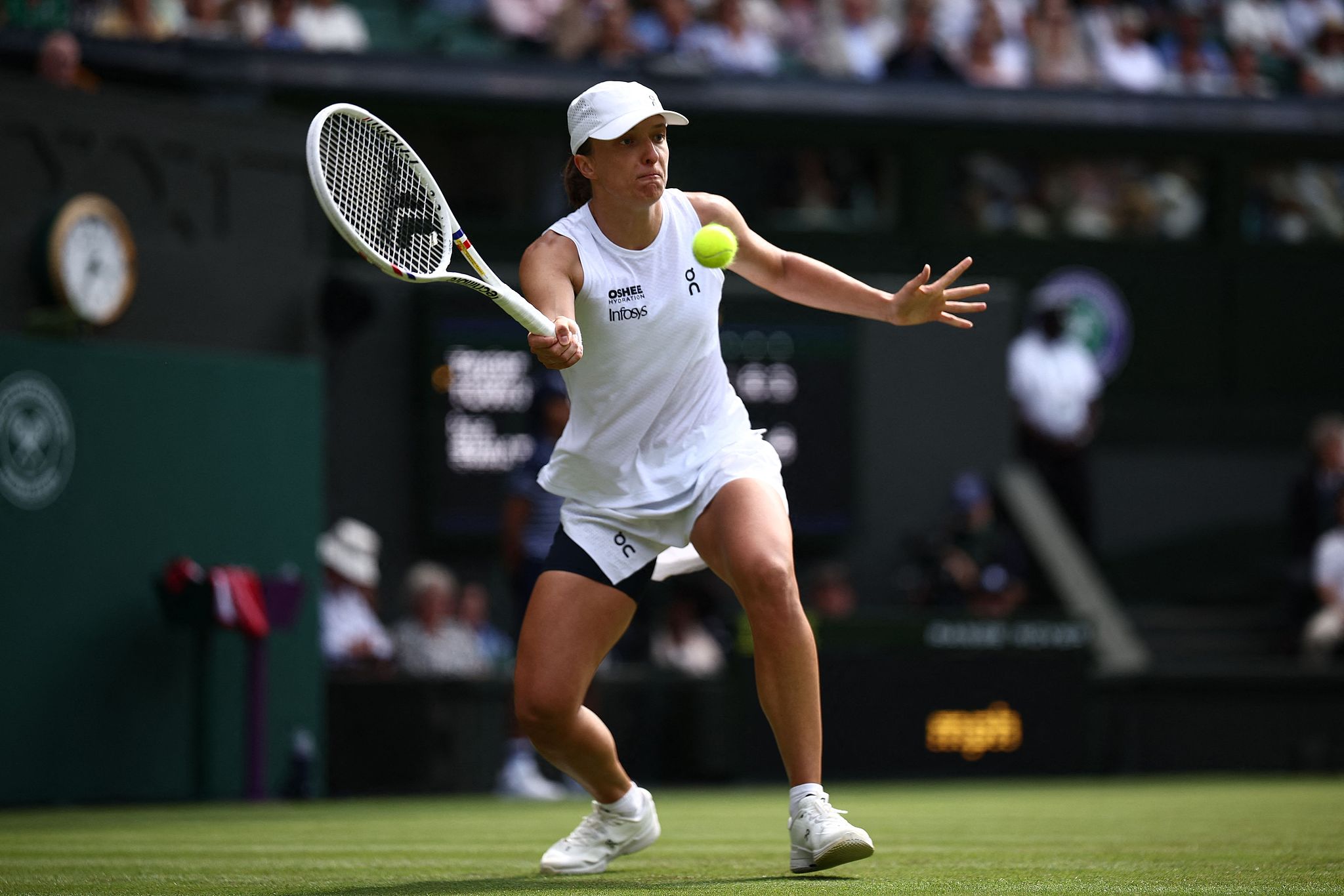 Poland's Iga Swiatek hits a shot in the women's singles first-round match against the USA's Taylor Townsend at the Wimbledon Championships at the All England Lawn Tennis and Croquet Club in London, England, June 30, 2026. /VCG