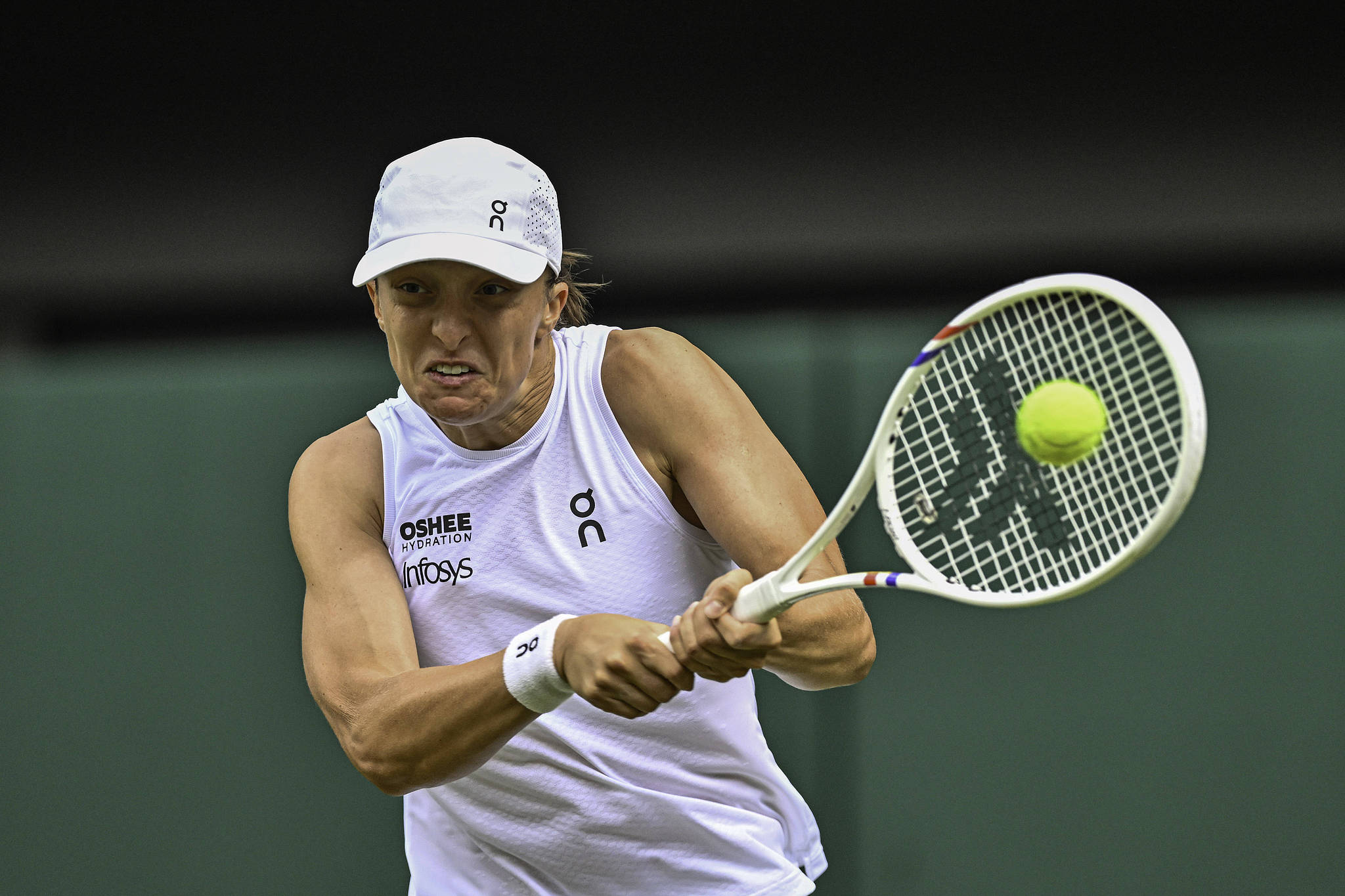 Poland's Iga Swiatek hits a shot in the women's singles first-round match against the USA's Taylor Townsend at the Wimbledon Championships at the All England Lawn Tennis and Croquet Club in London, England, June 30, 2026. /VCG