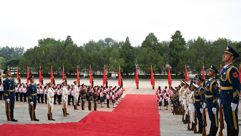 Honor guards and children are pictured outside the Great Hall of the People in Beijing, capital of China for the gathering to celebrate the 105th founding anniversary of the Communist Party of China (CPC), July 1, 2026. /Xinhua