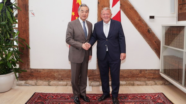 Chinese Foreign Minister Wang Yi, also a member of the Political Bureau of the Communist Party of China Central Committee, shakes hands with Danish Foreign Minister Lars Lokke Rasmussen in Copenhagen, Denmark, July 2, 2026. /Chinese Foreign Ministry