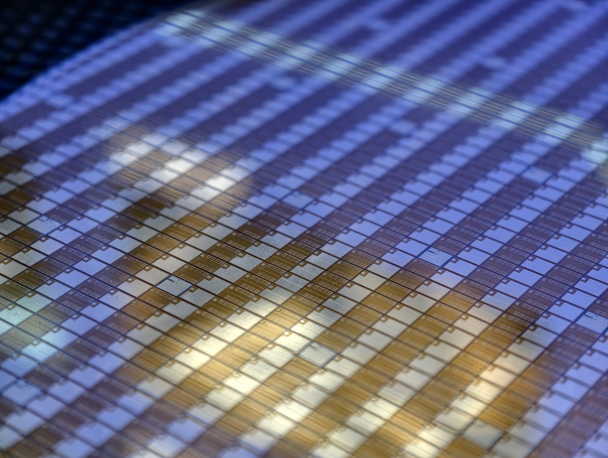 Close-up of a mature-node memory chip die exhibited at the Oriental Chip Port Frontier Industry Exhibition Hall, Lingang Free Trade Zone, Pudong, Shanghai, China, June 24, 2026. /VCG