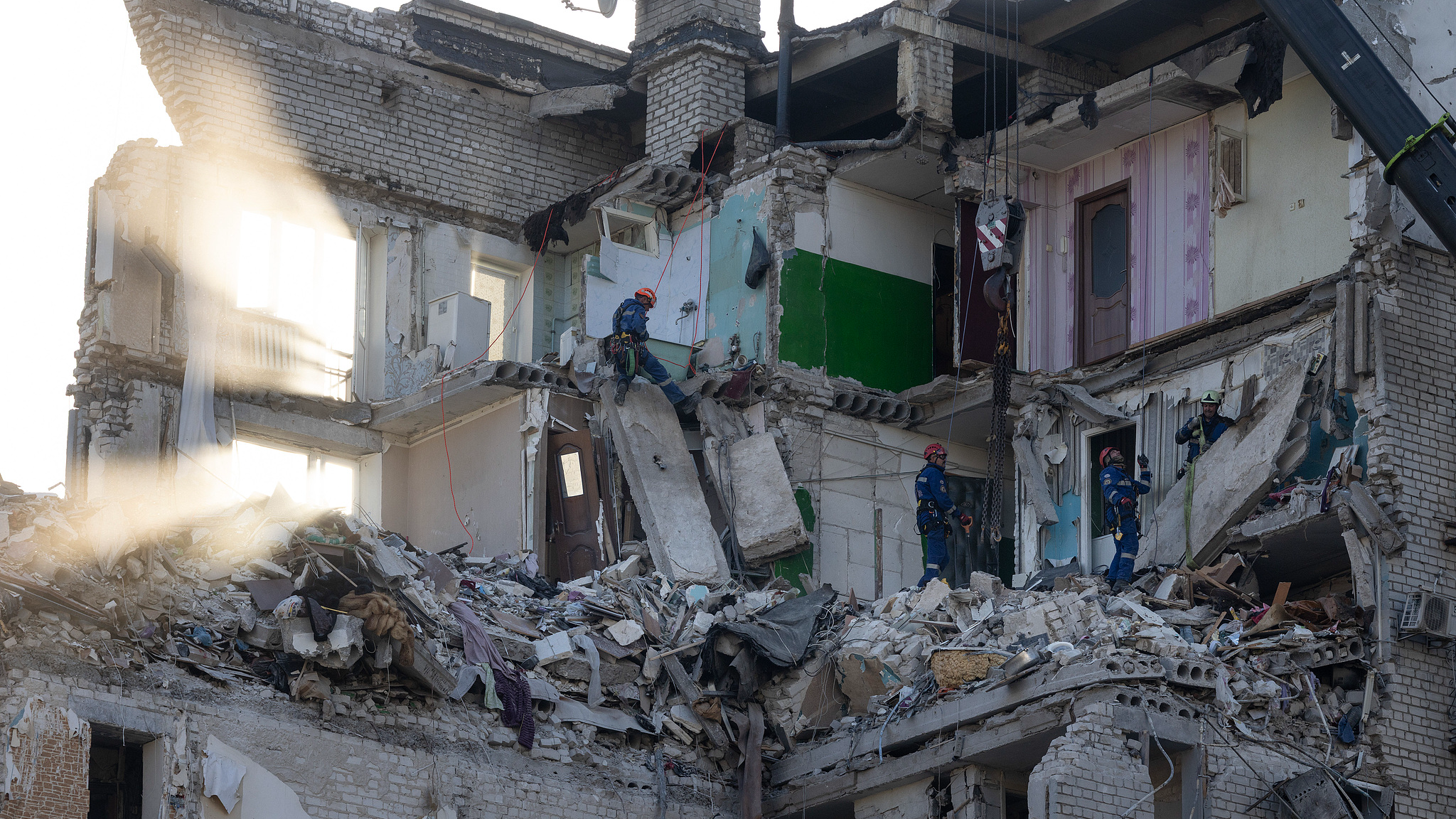 Rescue workers continue to search for survivors by digging through the rubble of a residential building that collapsed after a drone and missile attack by Russian forces in Kyiv, Ukraine, July 2, 2026. /VCG