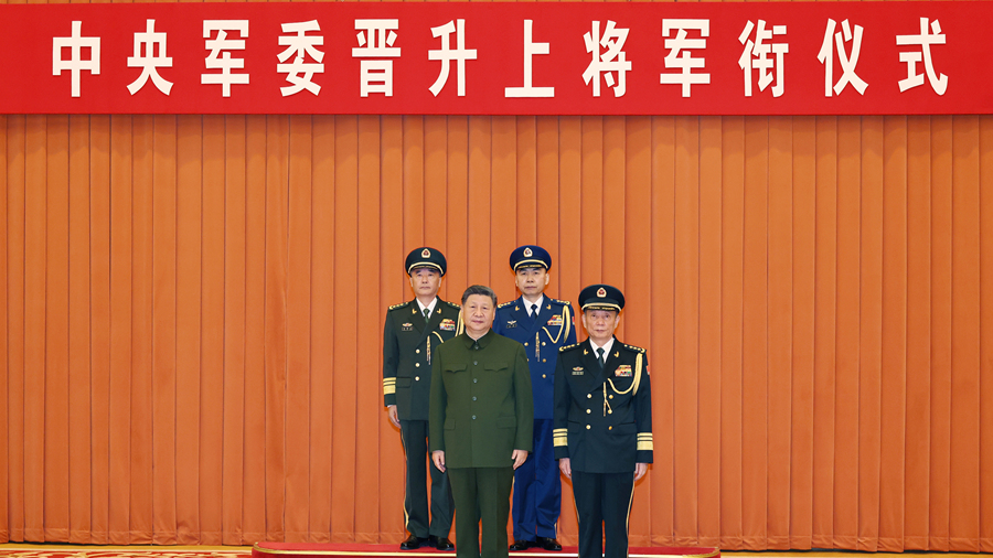 Xi presents orders to promote two military officers to rank of general