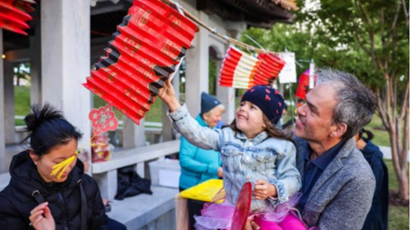 People look at a lantern during an event in celebration of the Lantern Festival at the Beijing Garden by Lake Burley Griffin in Canberra, Australia, February 4, 2023. /Xinhua