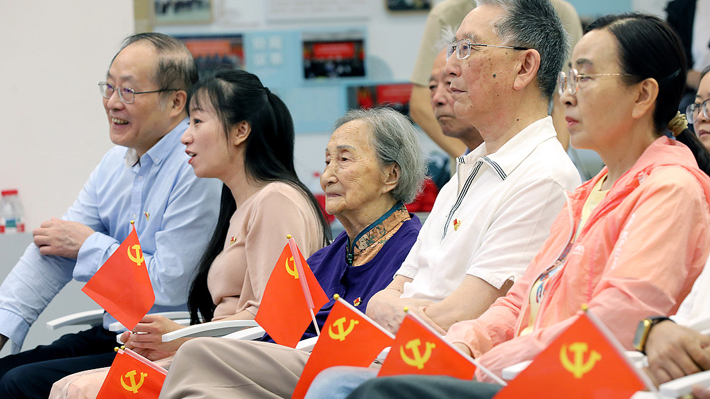 Members of the Communist Party of China (CPC) watch the live broadcast of the celebration marking the 105th anniversary of the founding of the Party with people, Hangzhou City, Zhejiang Province, China, July 1, 2026. /VCG
