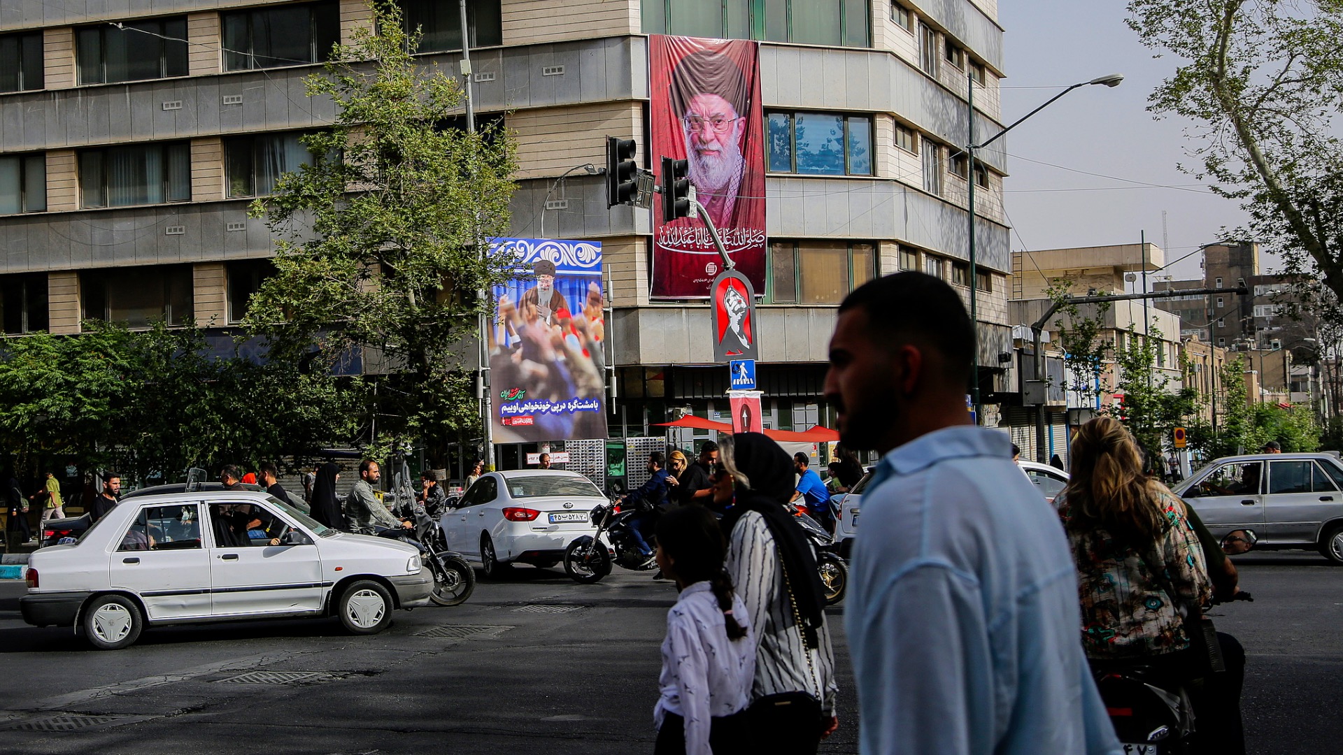 Large banners bearing the portrait of Iran's late Supreme Leader Ali Khamenei are displayed across city squares in Tehran, Iran, July 3, 2026. /VCG