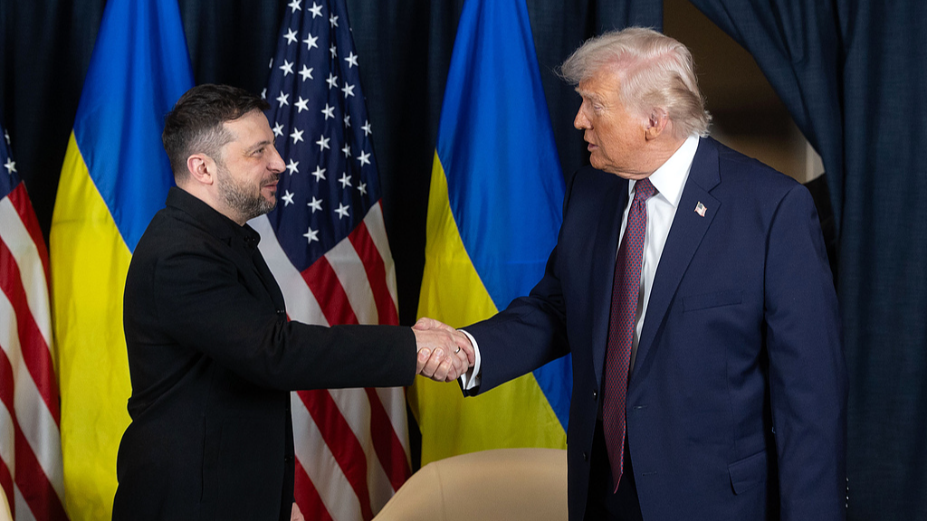 Ukraine's President Volodymyr Zelenskyy (L) and US President Donald Trump shake hands during their bilateral meeting on the sidelines of the World Economic Forum (WEF) annual meeting in Davos, Switzerland, January 22, 2026. /VCG