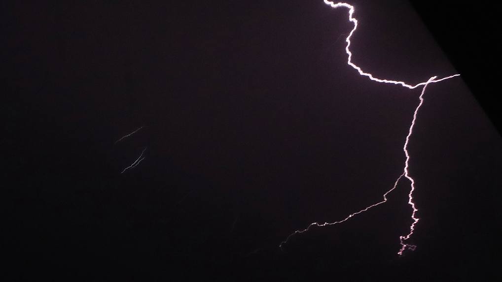 Lightning flashing over Fangchenggang City, Guangxi Zhuang Autonomous Region, July 7, 2026. /VCG