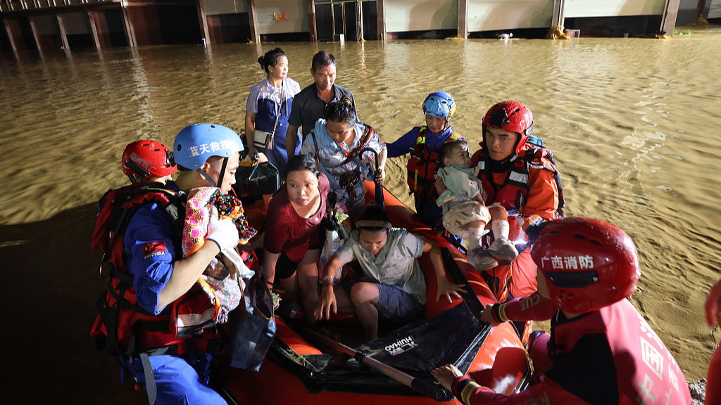 Rescue personnel evacuate residents at a flood-hit village in Nanning City, Guangxi Zhuang Autonomous Region, south China, July 6, 2026. /VCG