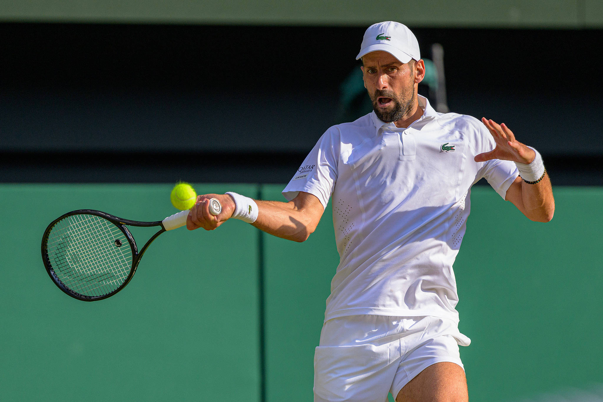 Serbia's Novak Djokovic hits a shot against Canada's Felix Auger-Aliassime in a men's singles quarterfinal match at the Wimbledon Championships at the All England Lawn Tennis and Croquet Club in London, England, UK, July 7, 2026. /VCG