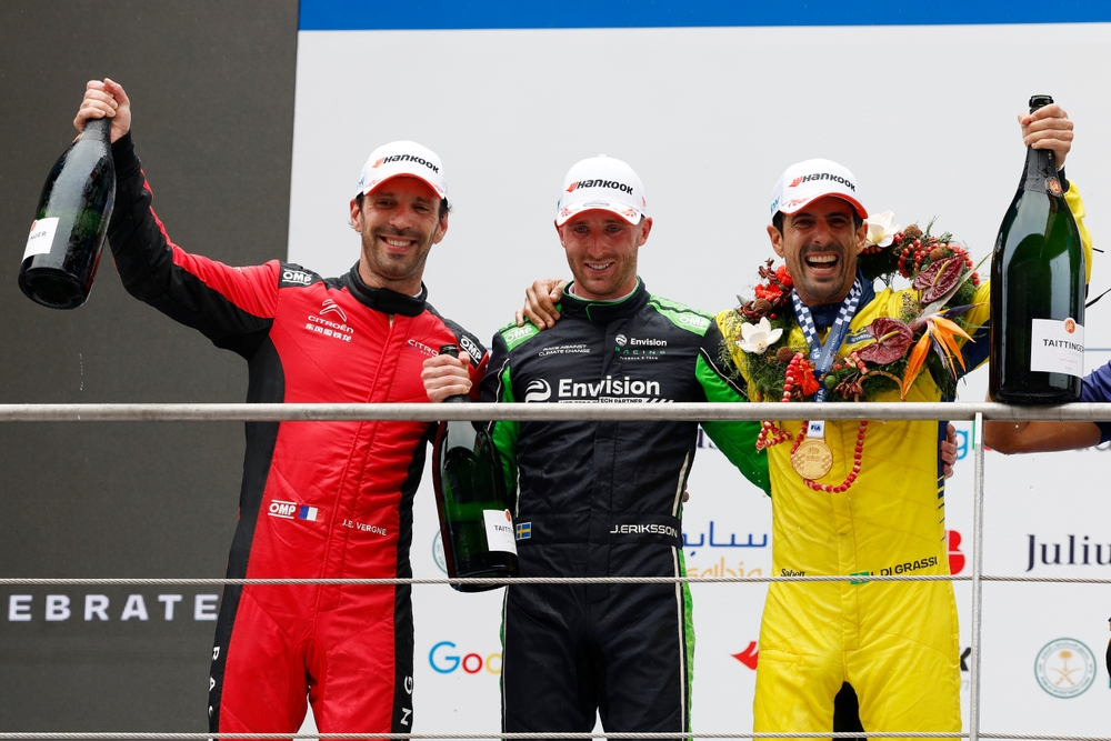 Joel Eriksson (centre) recorded a surprise podium finish for Envision Racing. /FIA Formula E