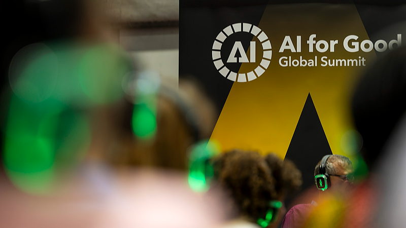 Visitors wearing headphones listen to a conference during the AI for Good Global Summit at Palexpo in Geneva, Switzerland, July 07, 2026. /VCG