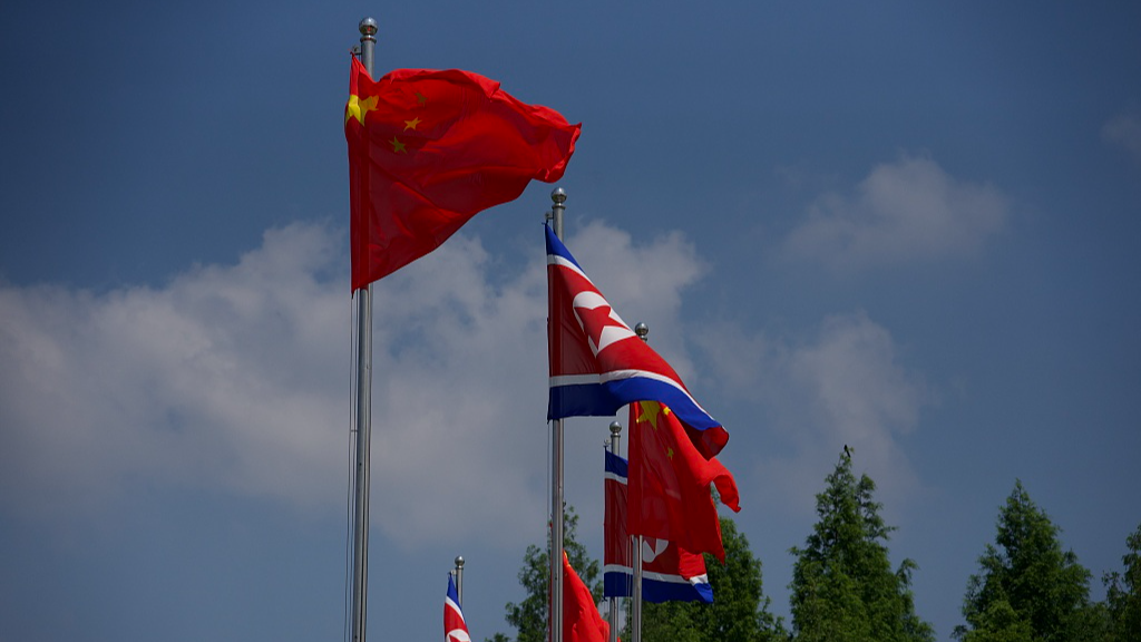 The national flags of China and the Democratic People's Republic of Korea (DPRK) line a street of Pyongyang, DPRK, June 8, 2026. /VCG