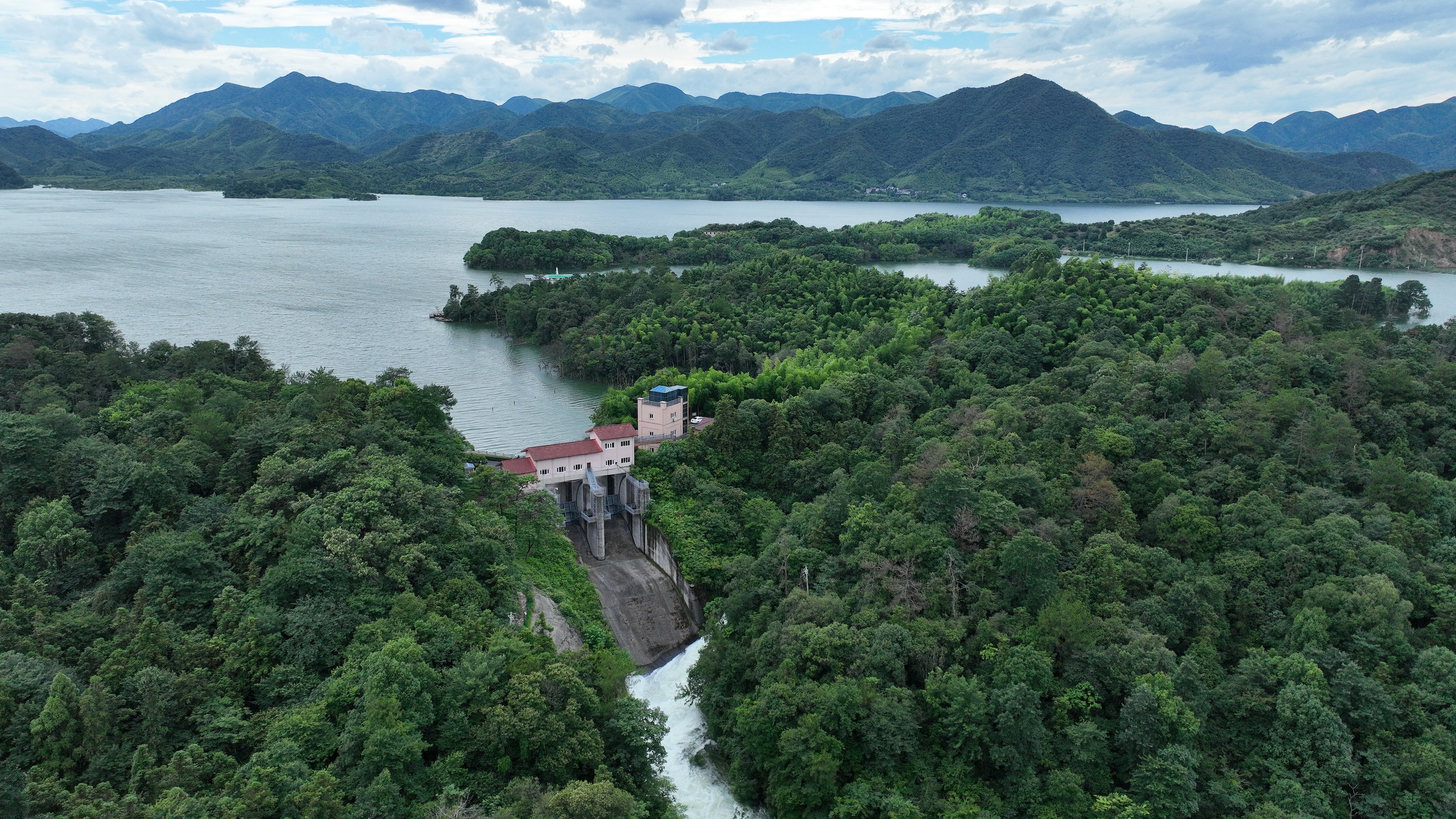 Duihekou Reservoir opens its floodgates to release water in Deqing County, Huzhou City, China's Zhejiang Province, on July 7, 2026, ahead of heavy rainfall forecast from Super Typhoon Bavi. /VCG