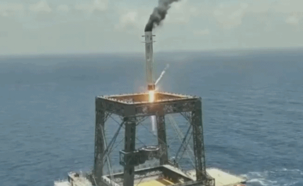 The first stage of China' Long March-10B rocket is captured by the 