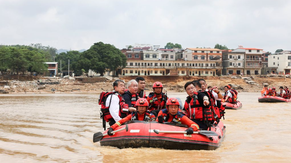 Chinese Vice Premier Zhang Guoqing (2L), also a member of the Political Bureau of the Communist Party of China Central Committee, takes a rescue boat to visit disaster-affected residents in Hengzhou, south China's Guangxi Zhuang Autonomous Region, July 10, 2026. /Xinhua