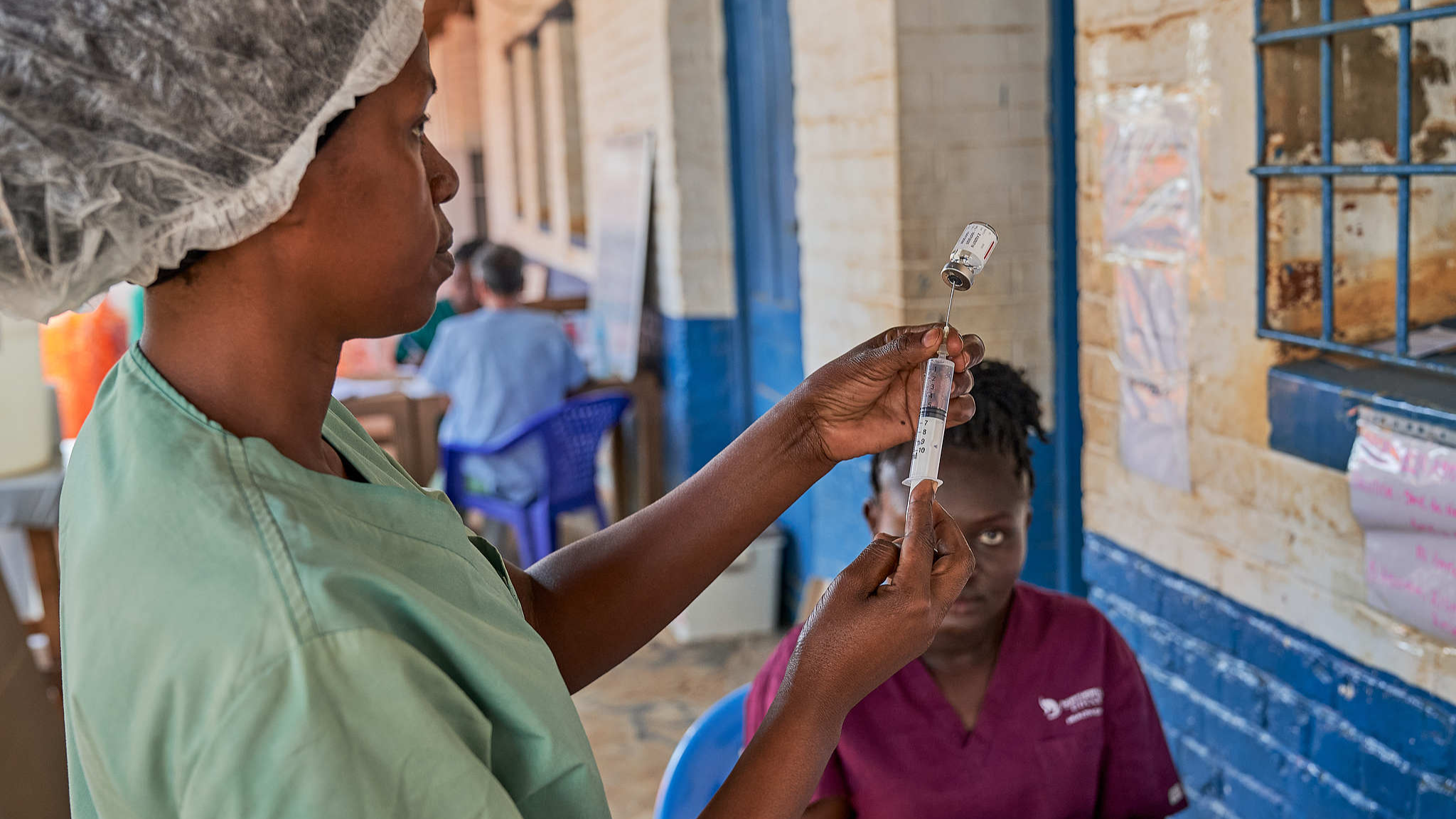 Medical staff member prepares medicine at the hospital in Mongbwalu, Ituri, Democratic Republic of Congo, June 26, 2026. /VCG