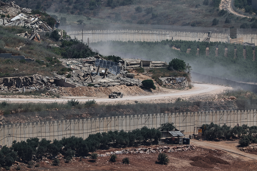 An Israeli military vehicle maneuvers on the Lebanese side of the Israel-Lebanon border, as seen from the Upper Galilee, Israel, 28 June 2026. /VCG