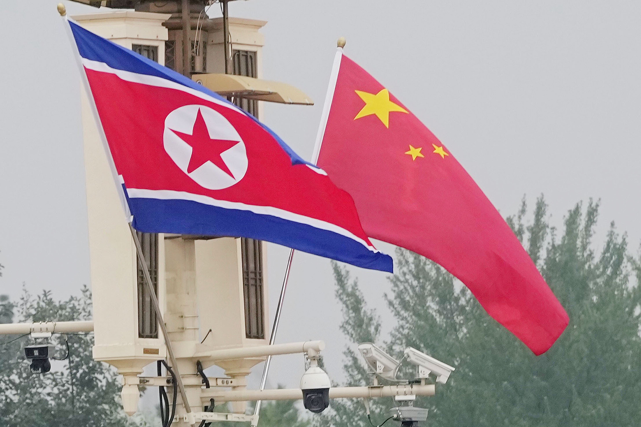 Chinese and DPRK national flags fly near Tiananmen Square to welcome arriving DPRK Premier Pak Thae Song, Beijing, China, July 10, 2026. /VCG