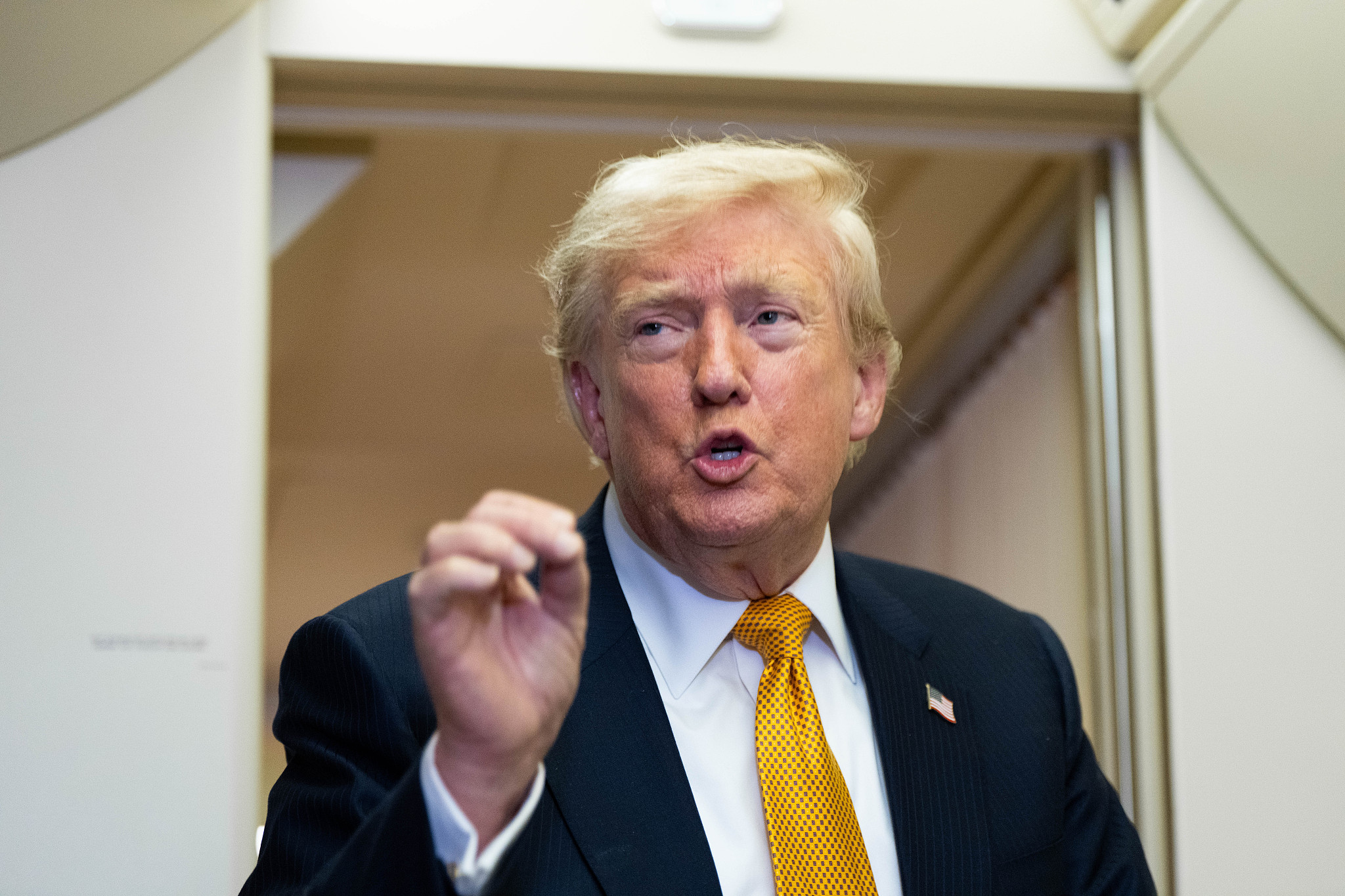 US President Donald Trump speaks with reporters in flight on Air Force One after landing at US Air Force Base at RAF Mildenhall, in Suffolk, Eastern England, Wednesday, July 8, 2026. /CFP