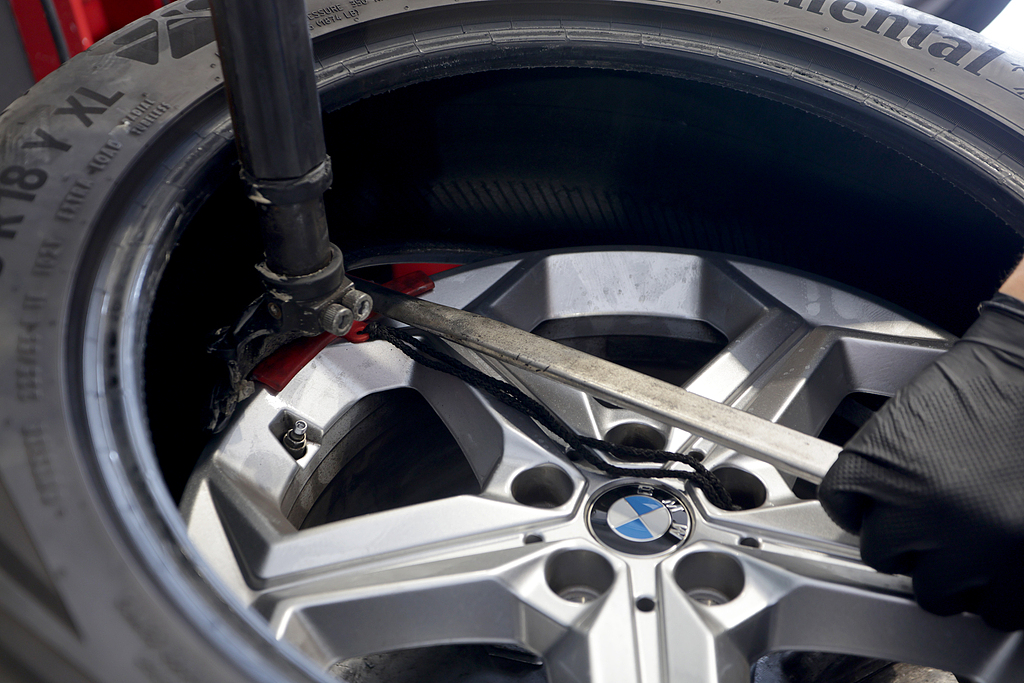 A car tire is changed in Bari, Italy, July 11, 2026. /CFP