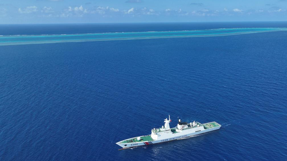 An aerial drone photo shows the China Coast Guard (CCG) vessel Sandu patrolling near a reef in the South China Sea on March 24, 2026. /Xinhua